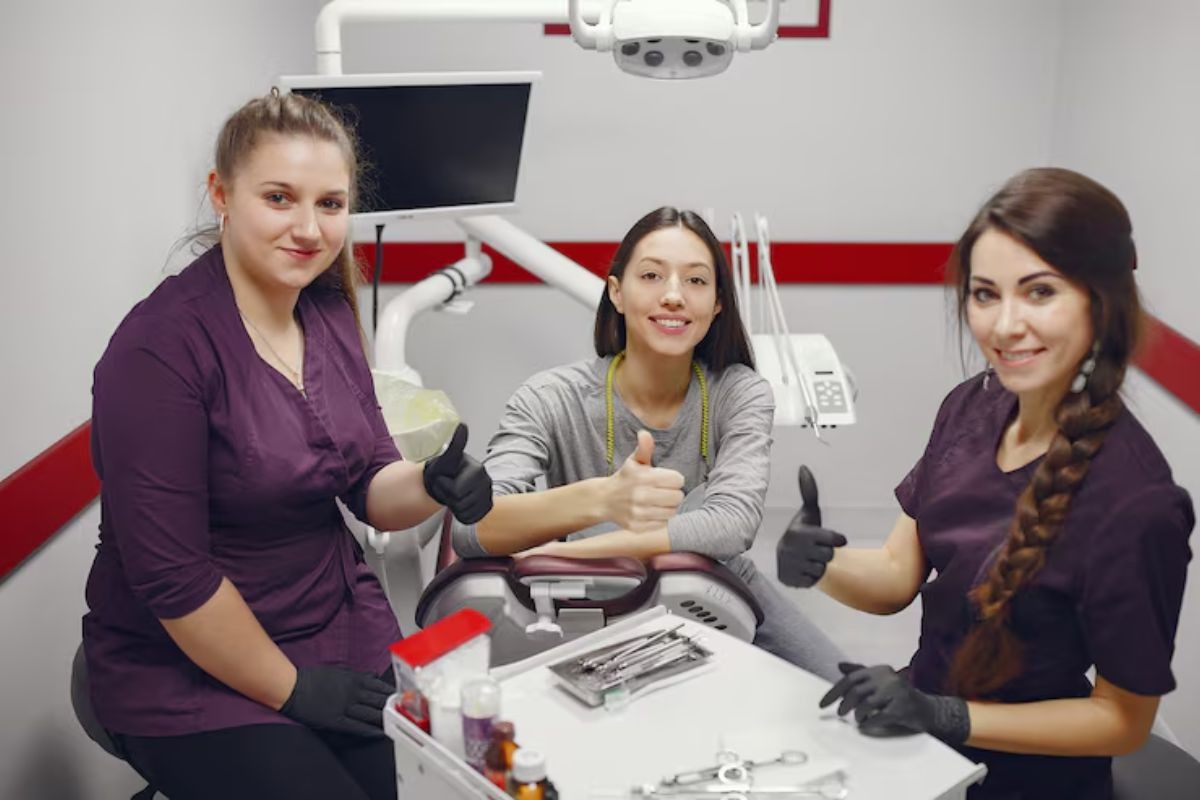 dental team supporting a patient during a dental practice coaching session
